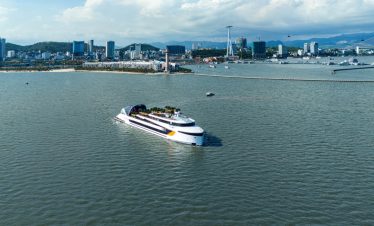 Luxury yacht cruising in the harbor of Ho Chi Minh City, Vietnam.