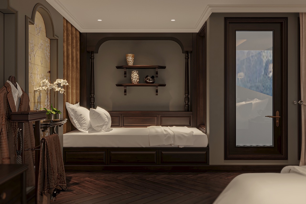 Luxurious hotel room with elegant dark wood furniture and scenic mountain view window.