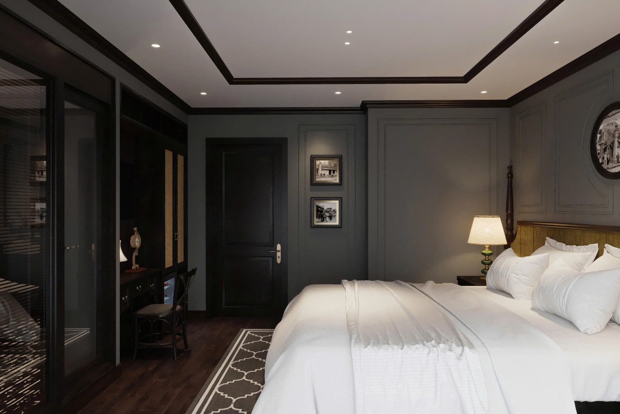 Luxurious hotel bedroom with elegant dark wood accents and modern decor.