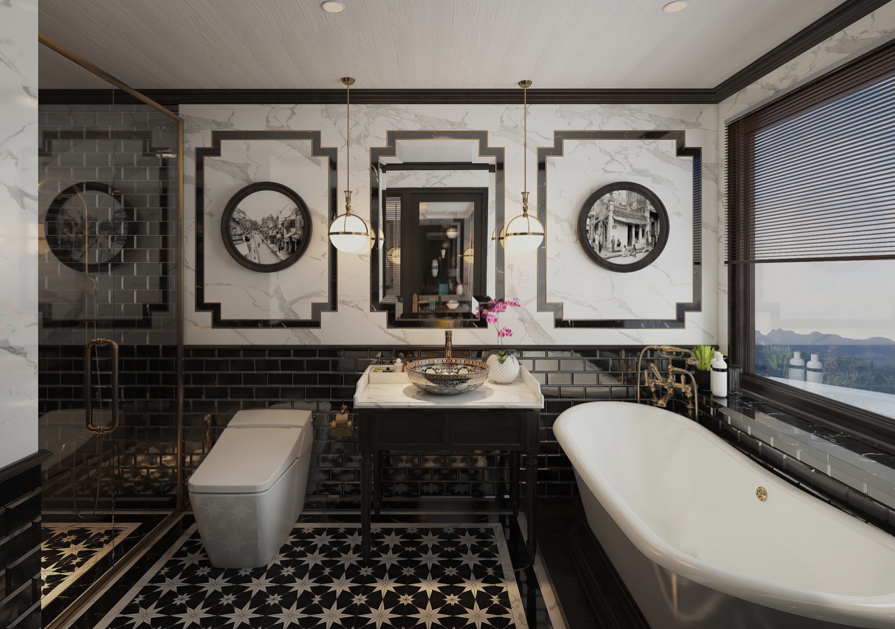 Luxurious modern bathroom with black and white marble accents, freestanding bathtub, and elegant fixtures.