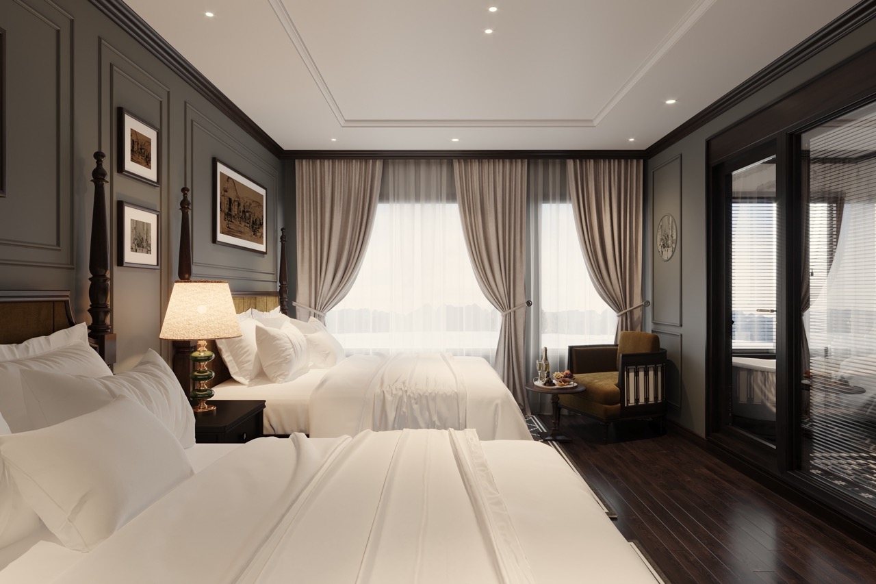 Luxurious hotel bedroom with elegant decor and large windows, perfect for a relaxing stay in Vietnam.