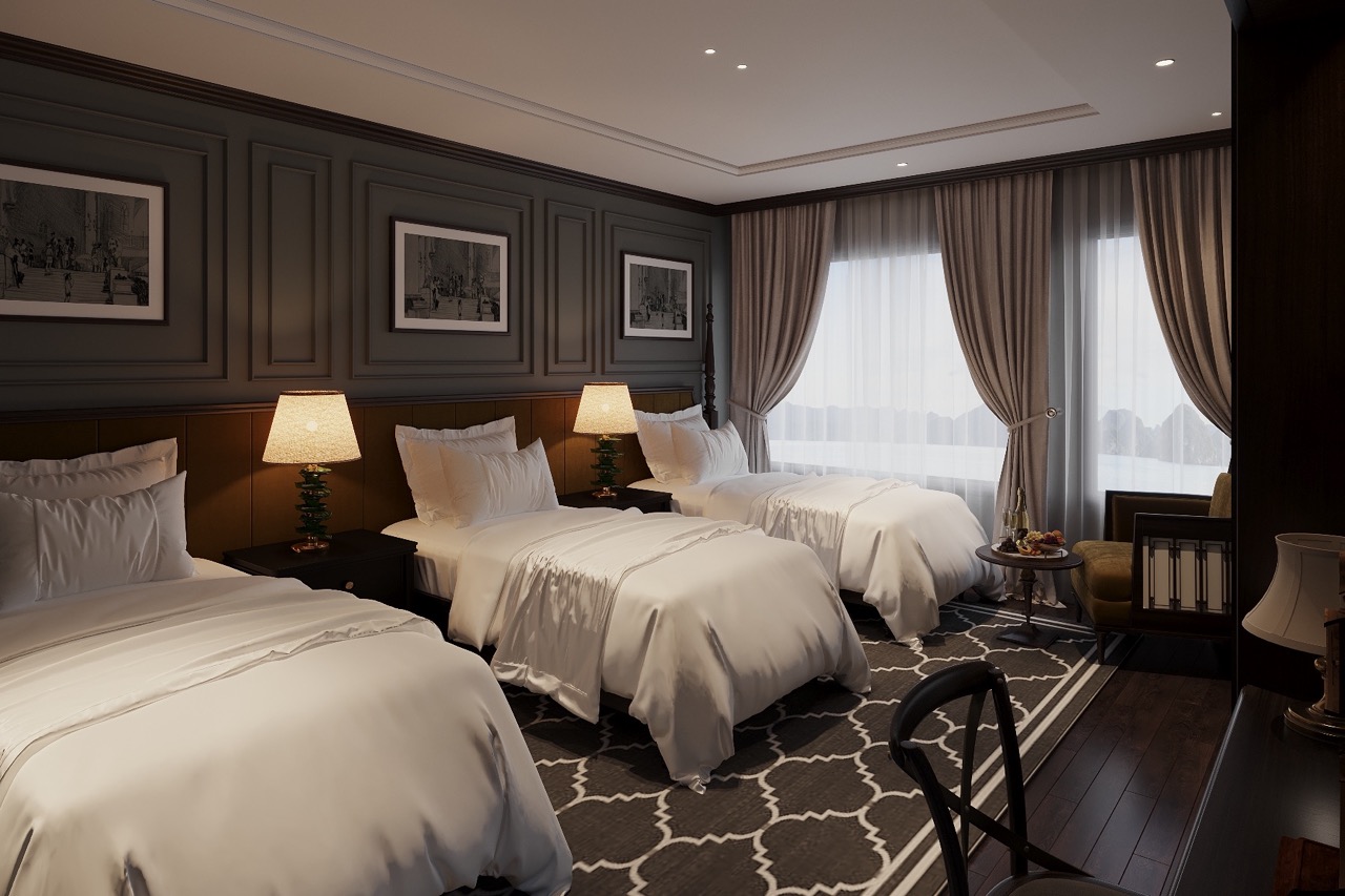 Luxurious hotel room with three beds, elegant decor, and scenic mountain view through large windows.