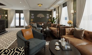 Luxurious waterfront hotel interior with elegant furnishings and scenic mountain views.