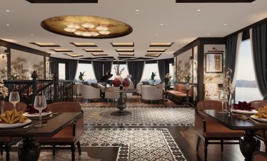 Elegant hotel lounge with luxurious decor and scenic sea view in the background, perfect for relaxation.