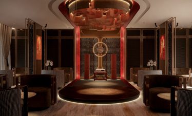 Luxurious modern lounge with elegant decor and ambient lighting for exclusive events and relaxation.