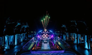 Vietnampool party with fireworks and vibrant lights at night.