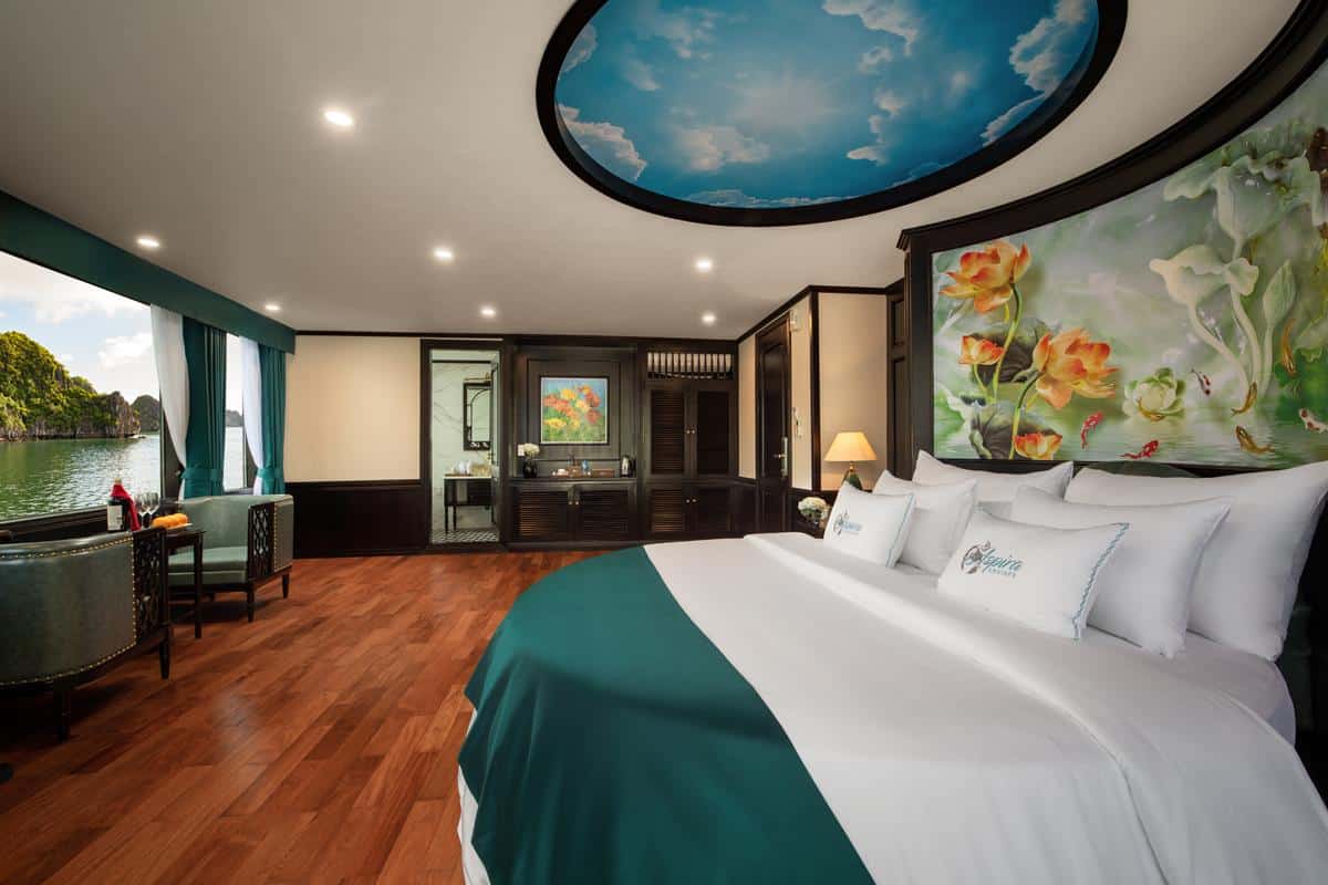 Luxurious hotel room with river view and artistic decor, perfect for relaxing vacation stays.