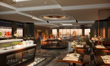 Luxurious restaurant interior with elegant decor and scenic ocean view.