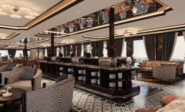 Luxurious hotel restaurant interior with elegant furnishings and panoramic city views.