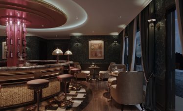 Luxurious hotel bar interior with elegant seating and ambient lighting, ideal for relaxation.