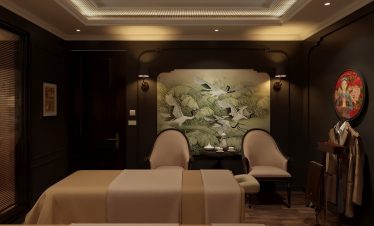 Elegant massage room with Asian artwork and dim lighting, perfect for relaxation at ViettrendTour.
