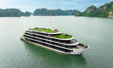 Lan Ha Bay Cruise 1 night - Luxurious cruise ship sailing through Lan Ha Bay with scenic limestone karsts.