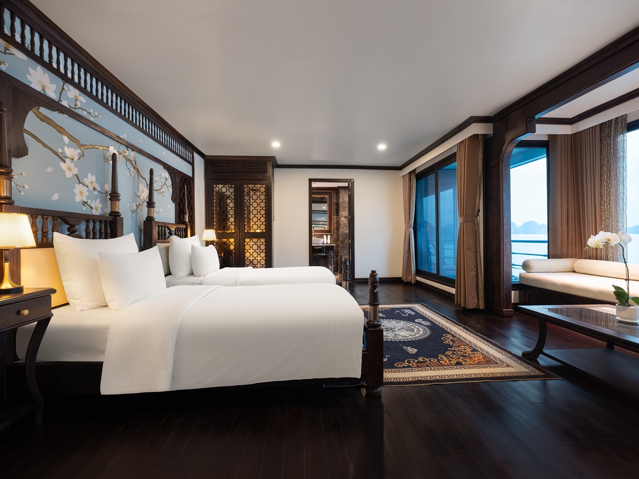 Elegant cruise balcony view of Lan Ha Bay with tranquil waters and scenic islands.