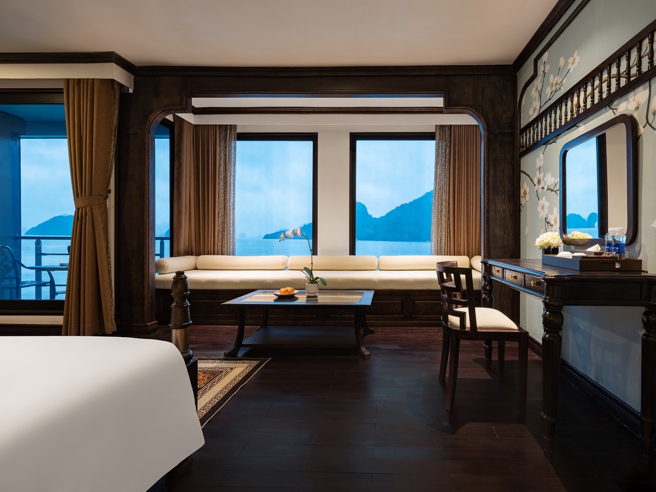 Stunning Halong Bay scenery from a luxurious cruise balcony, perfect for relaxing and enjoying the m.