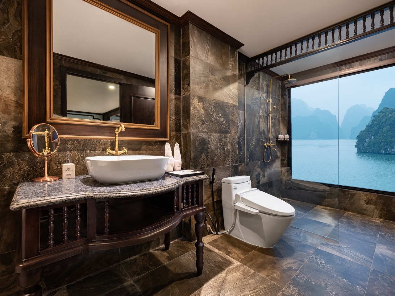 Luxurious Lan Ha Bay cruise balcony with stunning water views and elegant interior design.