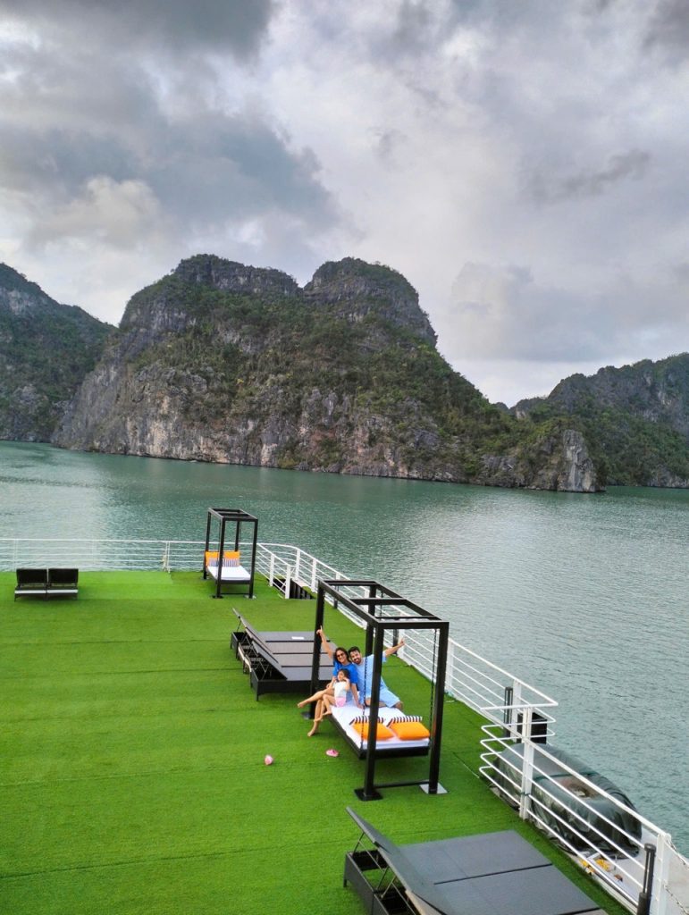 Lan Ha Bay scenic cruise balcony with limestone cliffs and tranquil waters, perfect for relaxing and.