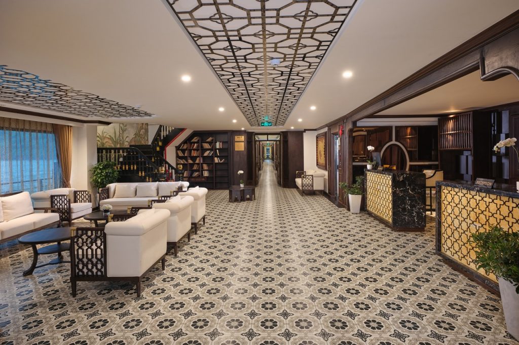 Spacious cruise lounge with elegant decor, comfortable seating, and ambient lighting, perfect for re.