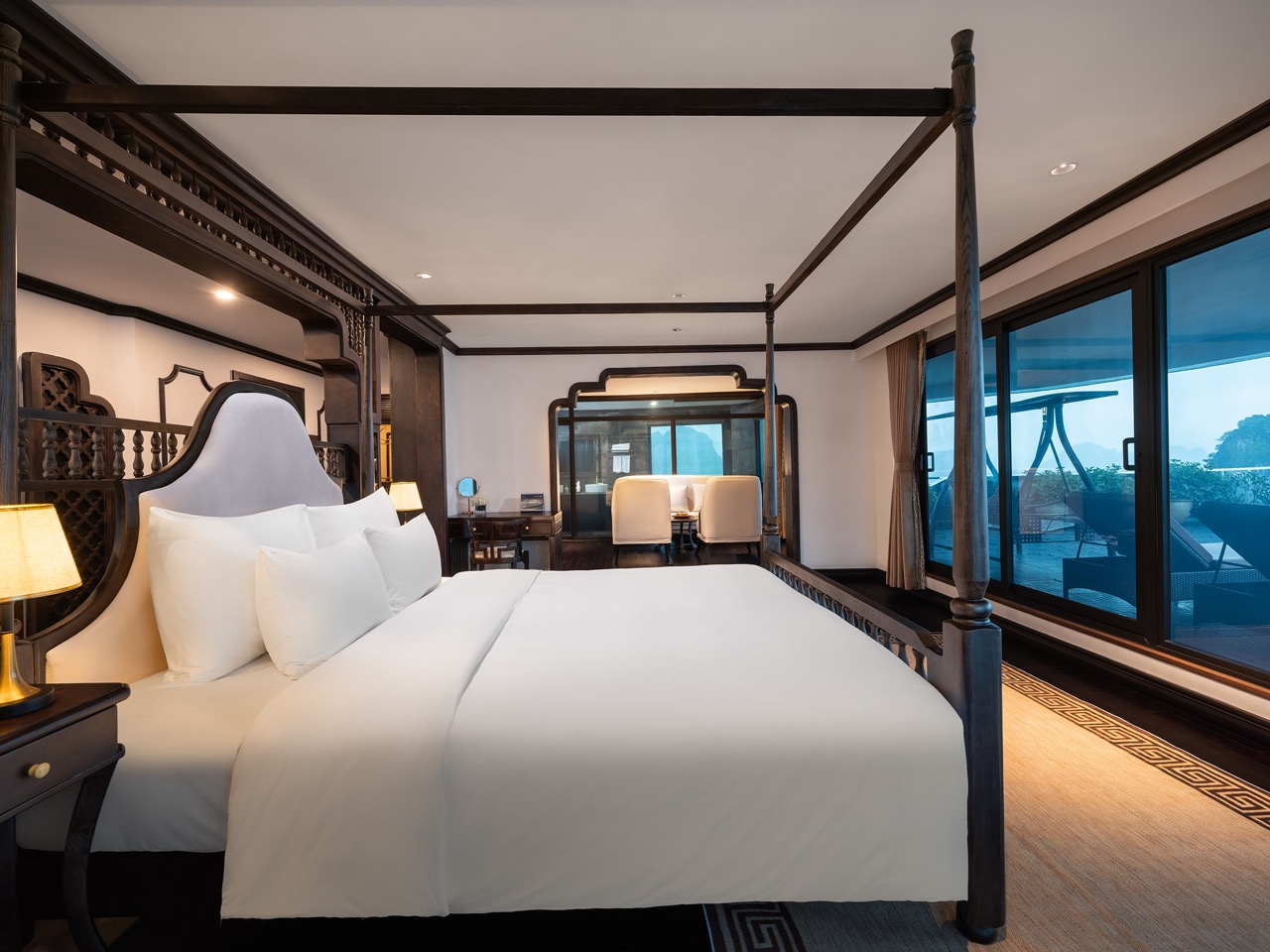 Elegant cruise bedroom with panoramic bay views, perfect for a romantic getaway in Lan Ha Bay.