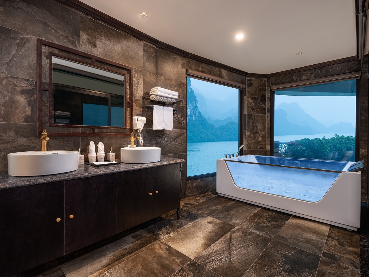 Luxury Lan Ha Bay cruise bathroom with stunning bay views, modern amenities, and elegant design.