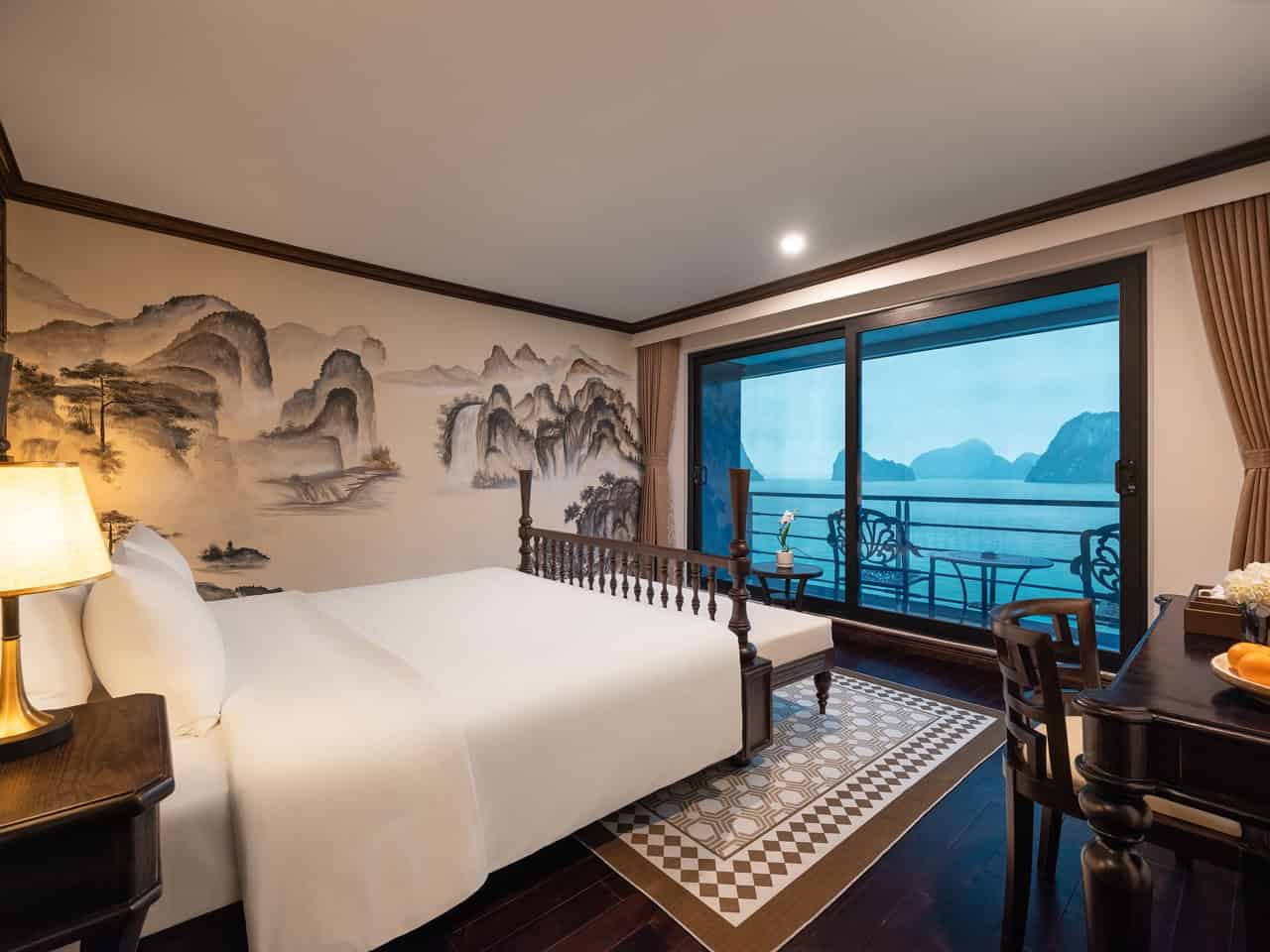 Lan Ha Bay cruise balcony with stunning mountain views and serene waters.