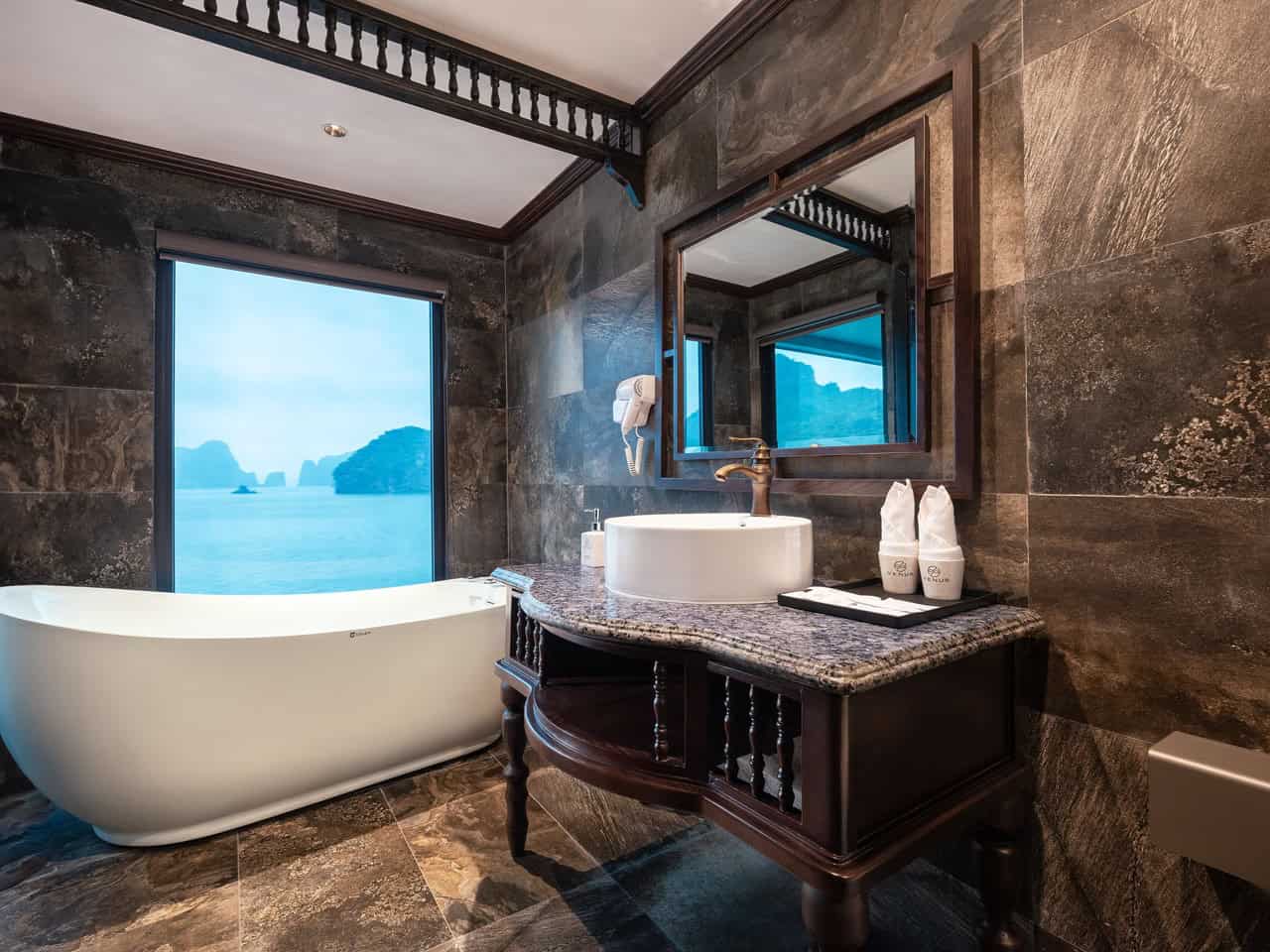 Ocean view bathroom on Lan Ha Bay cruise with modern amenities and elegant decor.