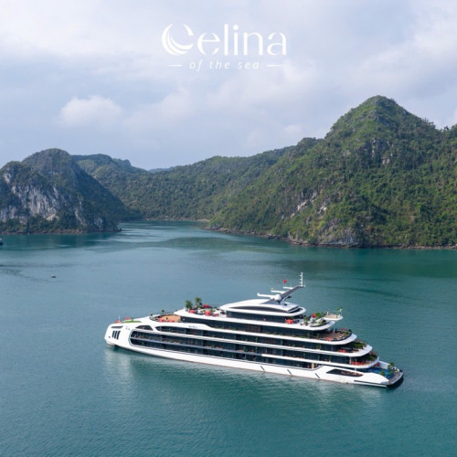 Large white luxury cruise ship in a calm turquoise bay with green, steep cliffs in the background. logo: Celina of the Sea at top center.