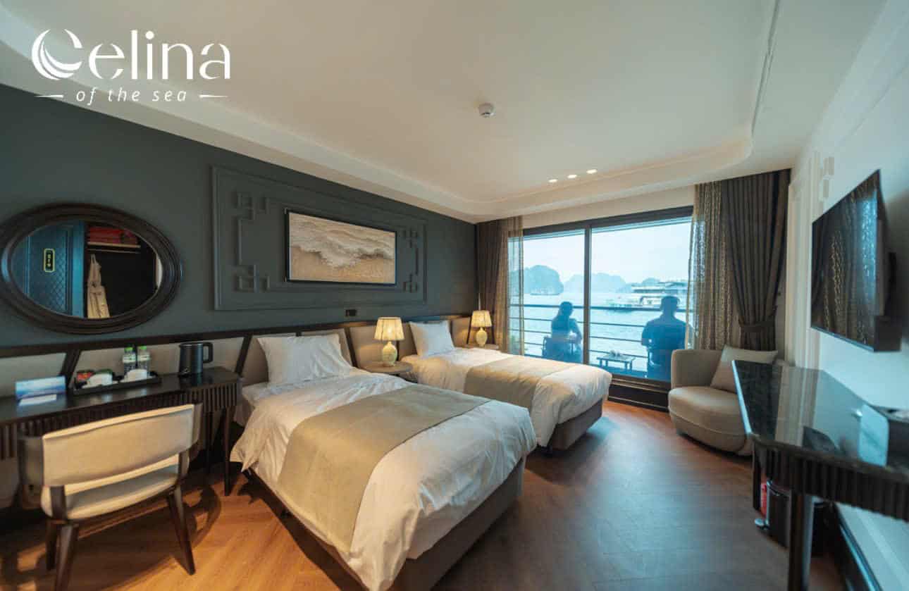 Hotel room with two single beds, sea-view balcony, and contemporary decor; logo reads 'Celina' in the top-left corner.
