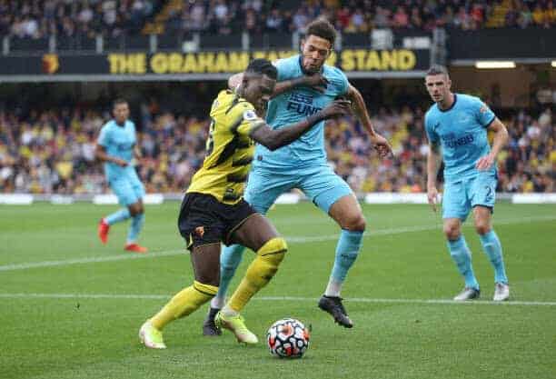 WATFORD, ENGLAND - SEPTEMBER 25: Watford's Ismaila Sarr and Newcastle United's Joelinton during the Premier League match between Watford and Newcastle United at Vicarage Road on September 25, 2021 in Watford, England. (Photo by Rob Newell - CameraSport via Getty Images)