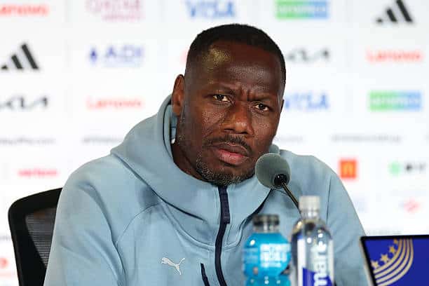 SEATTLE, WASHINGTON - JULY 01: Pape Thiaw, Head Coach of Senegal, speaks to the media in a post match press conference after the FIFA World Cup 2026 Round Of 32 match between Belgium and Senegal at Seattle Stadium on July 01, 2026 in Seattle, Washington. (Photo by Sarah Stier - FIFA/FIFA via Getty Images)