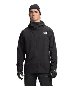 A person wearing a black jacket and gloves, suitable for cold weather, poses confidently with a neutral expression.