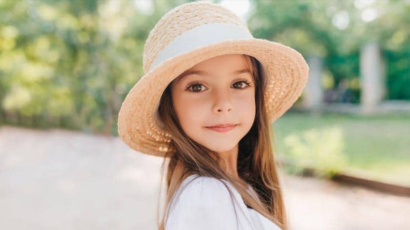 Beautiful girl wearing a straw hat