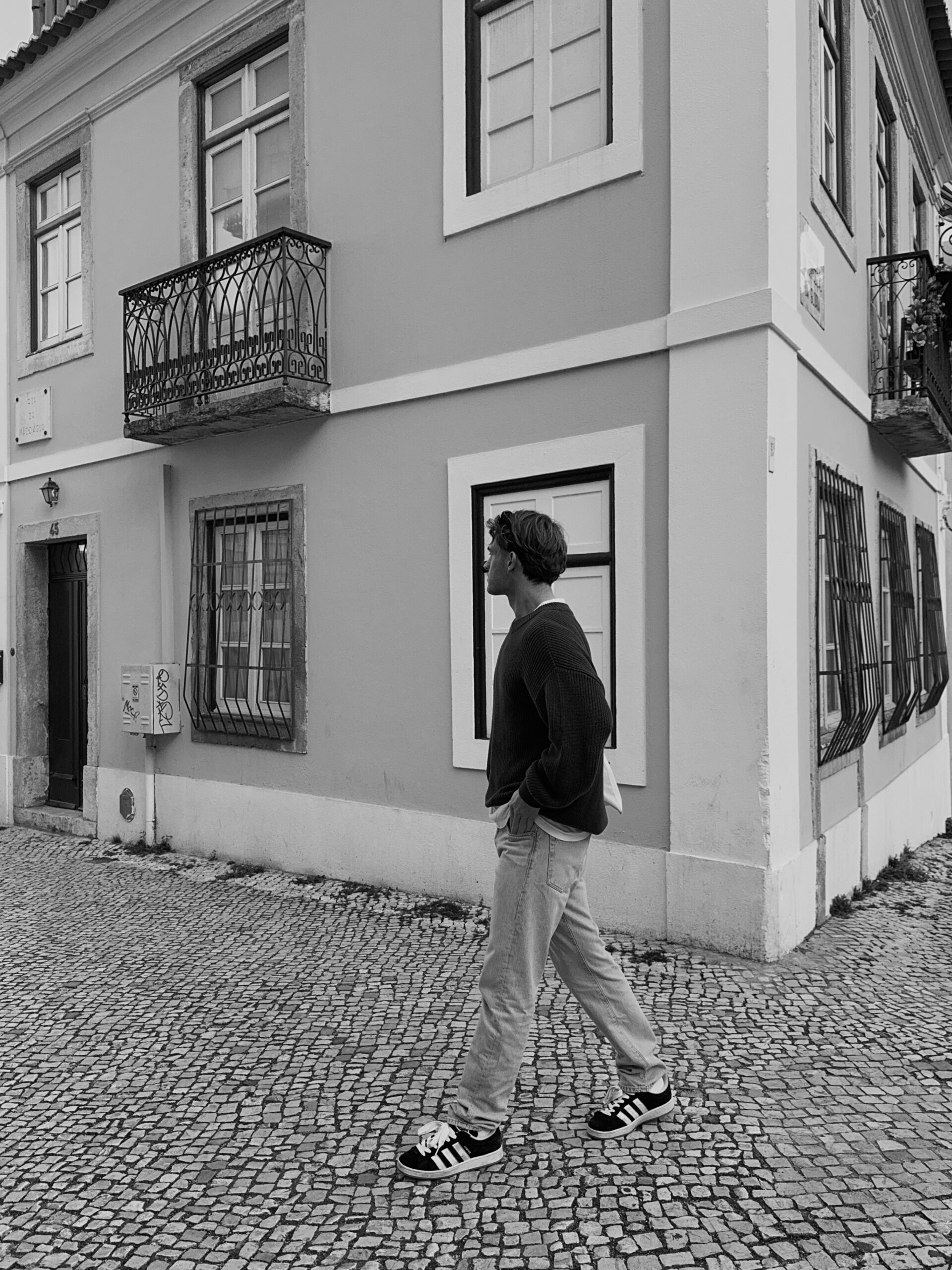 A stylish man walking to a date.