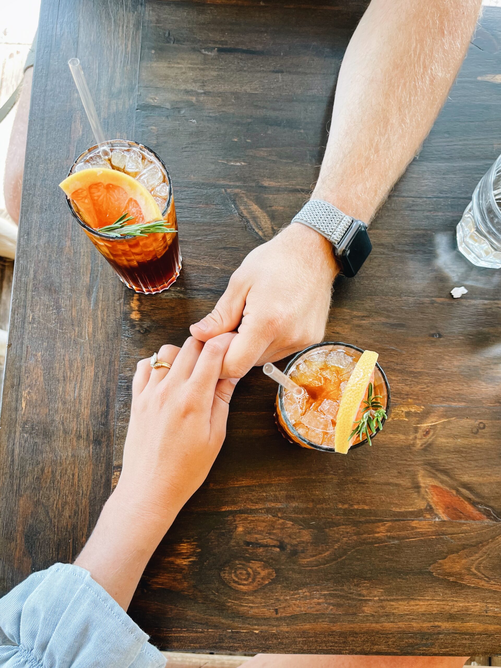 A couple holding hands.