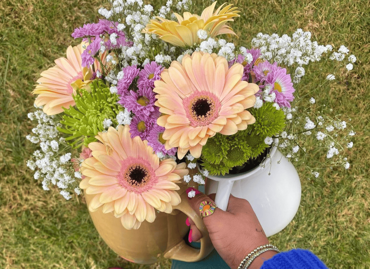 A woman with the flowers from her garden.