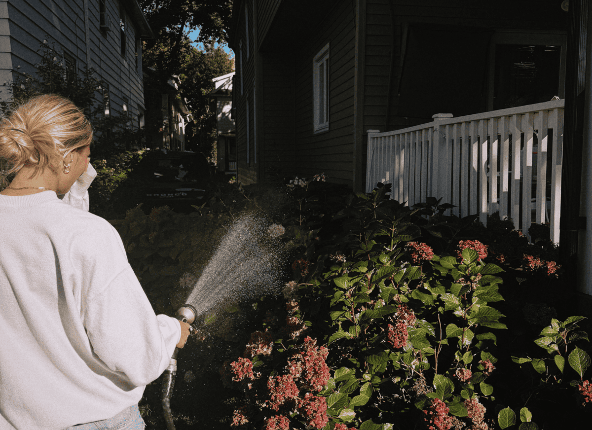 A woman taking care of her garden.
