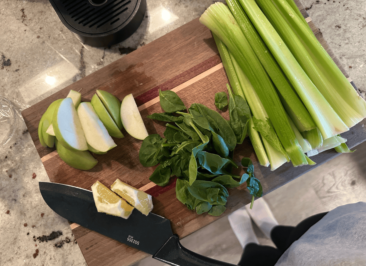 A person cutting up veggies.