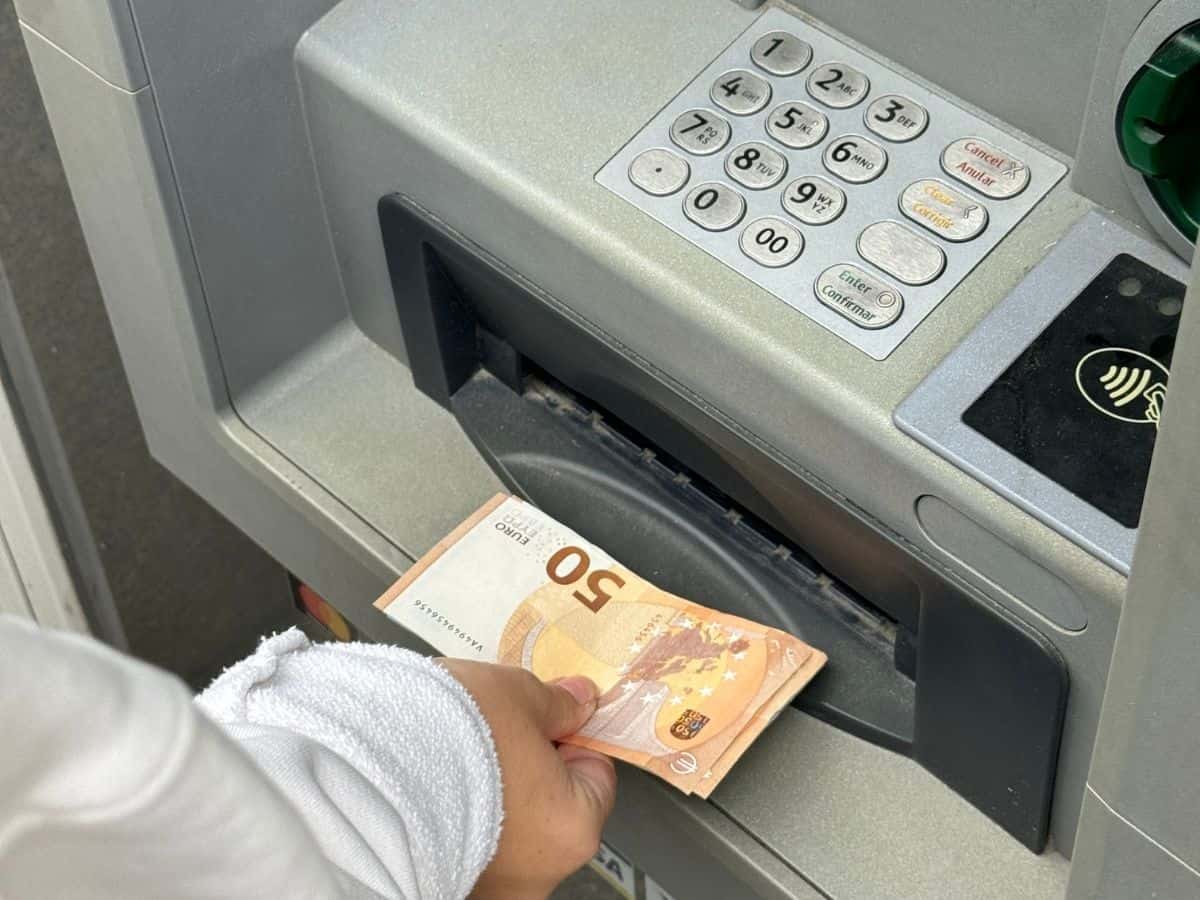 Taking money out of an ATM.