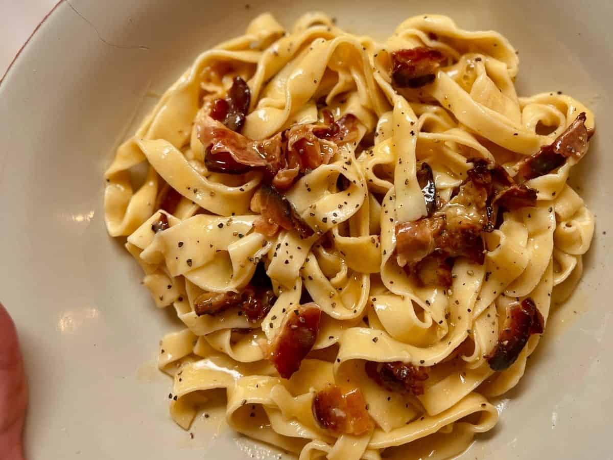 A plate of homemade pasta made by a cook.