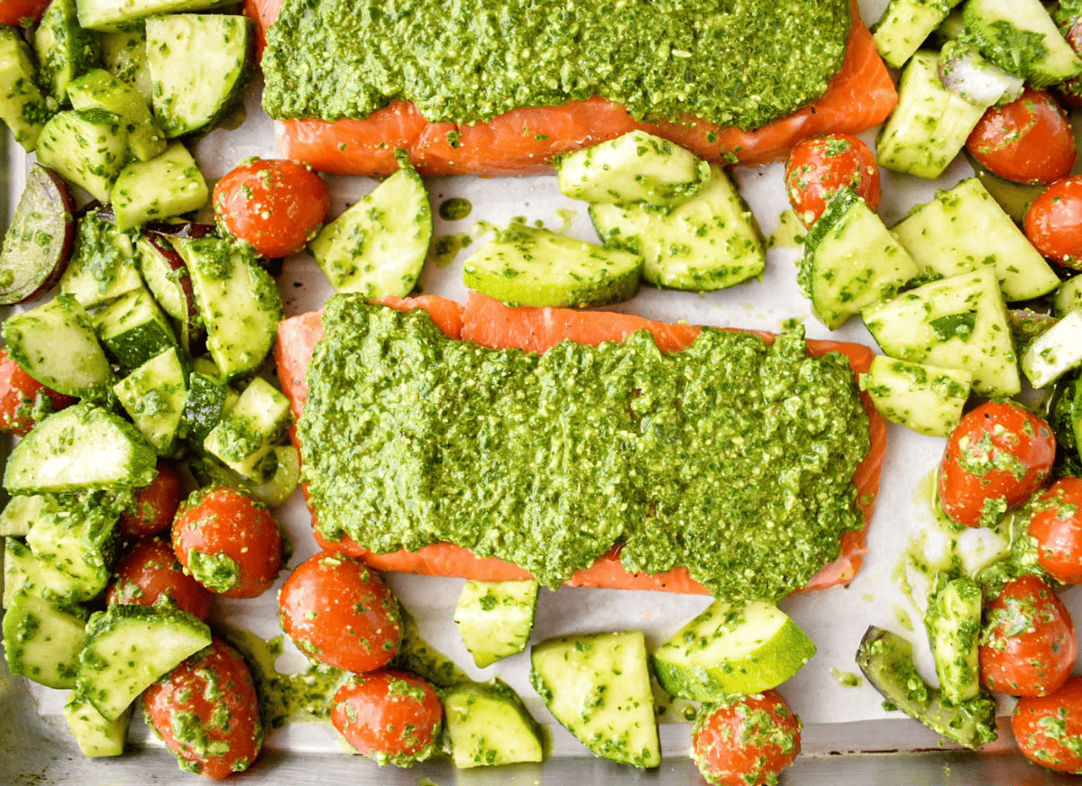 A mediterranean sheet pan dinner with salmon.