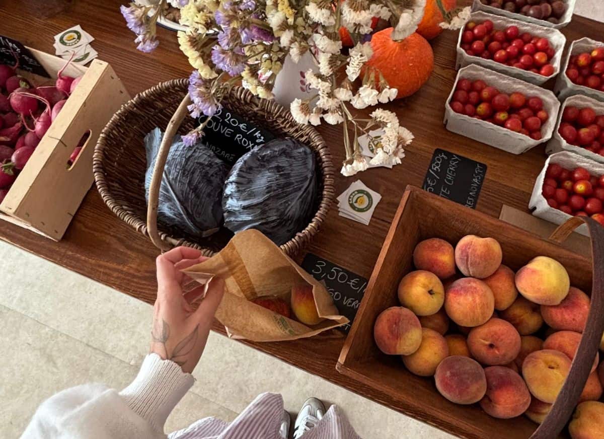 A person at the farmers market instead of drinking.