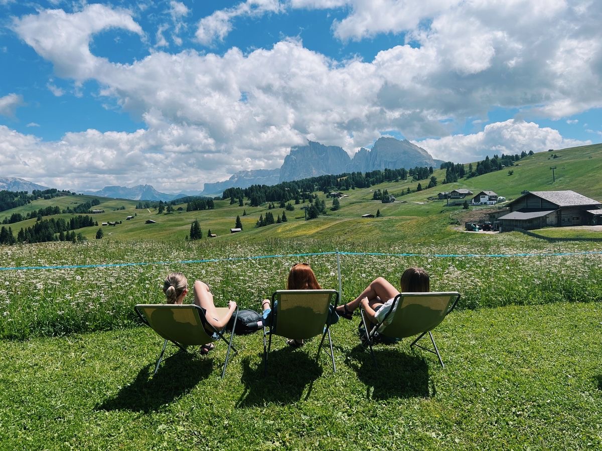 Adult friends hanging out in nature.