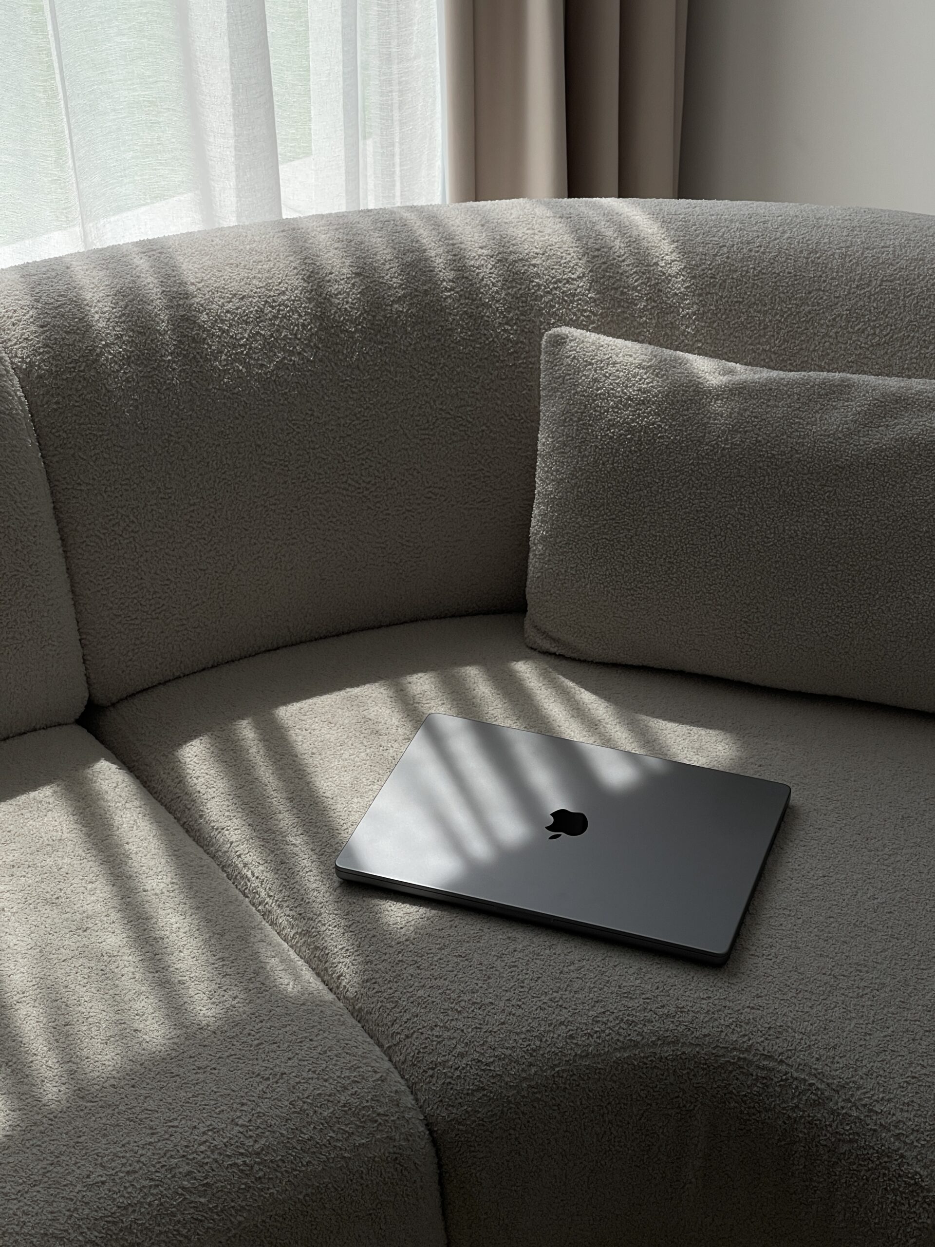 A computer on a couch.