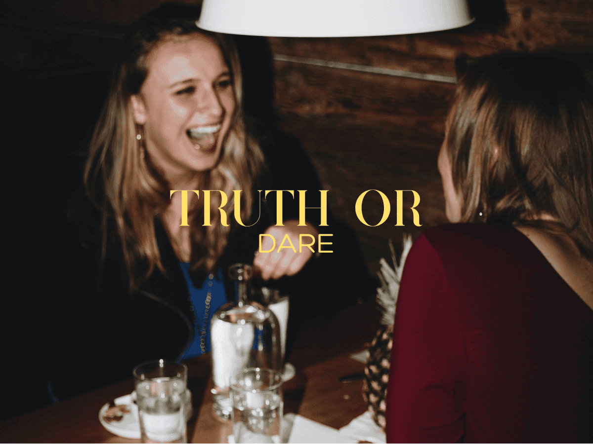 Truth or Dare Questions. Two woman laughing and hanging out together.