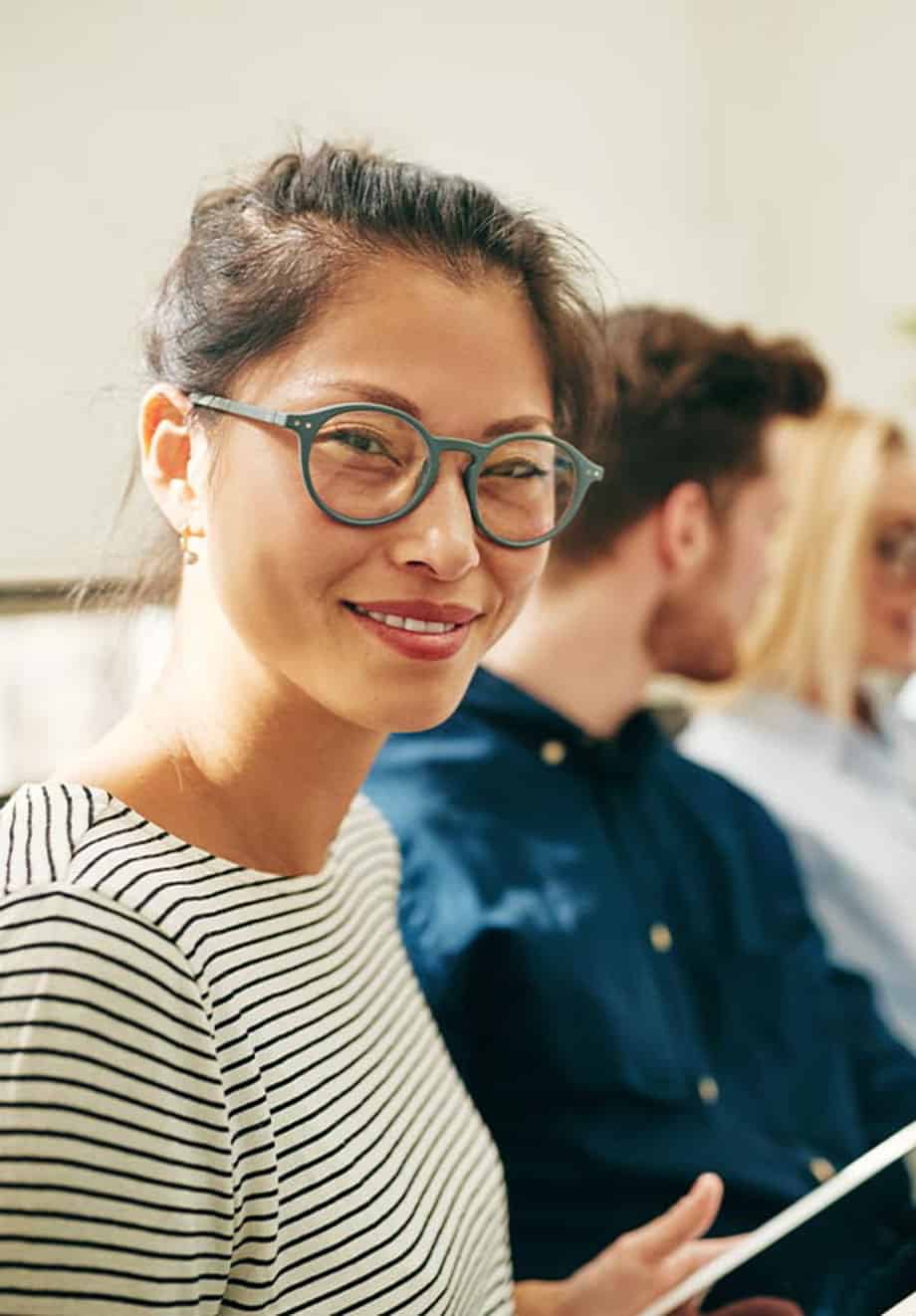woman working with group on project