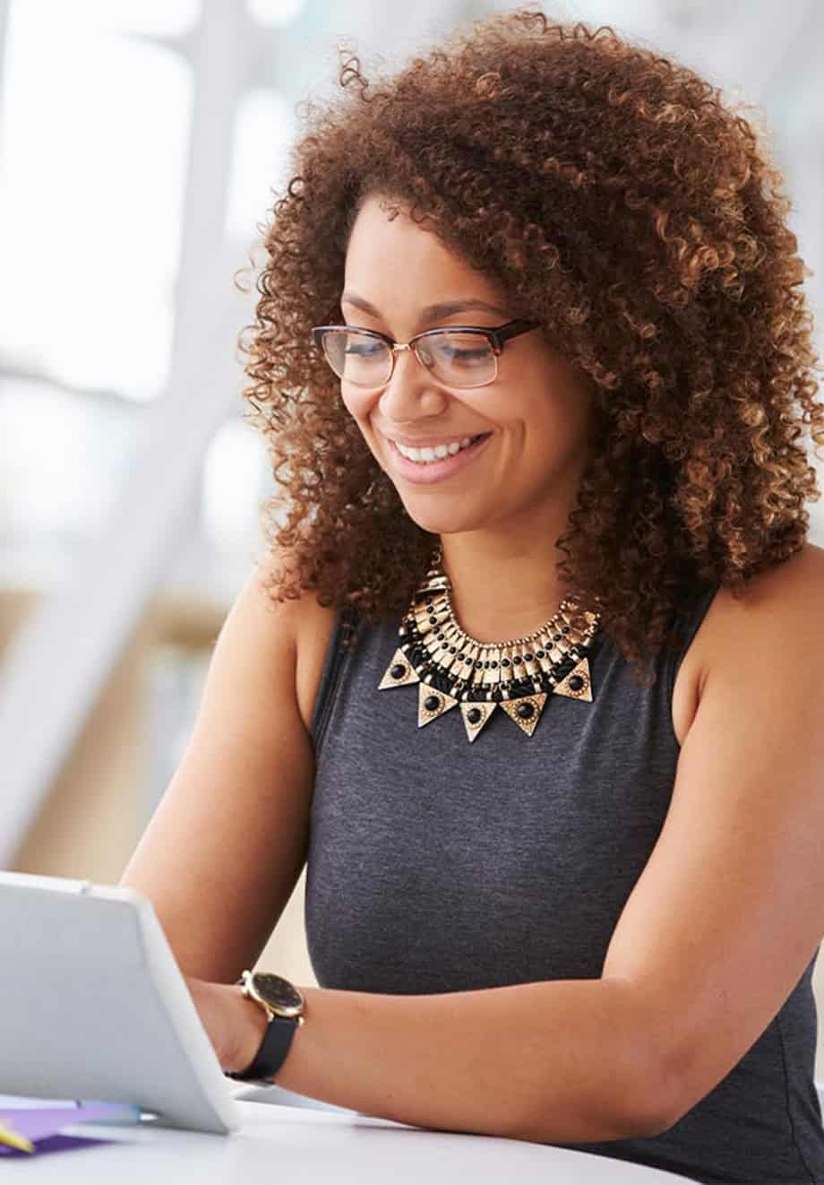 female employee sitting at work desk