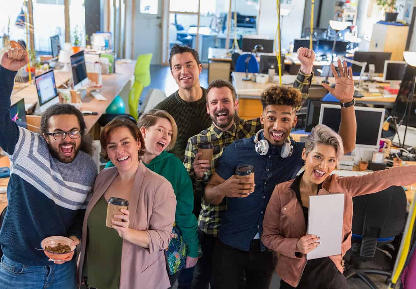 employees are busy at work but are enjoying the opportunity to try new learning programs because it helps them feel empowered and fulfilled at work