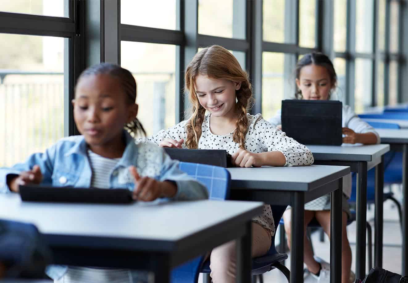 children-studying-tablets-technology