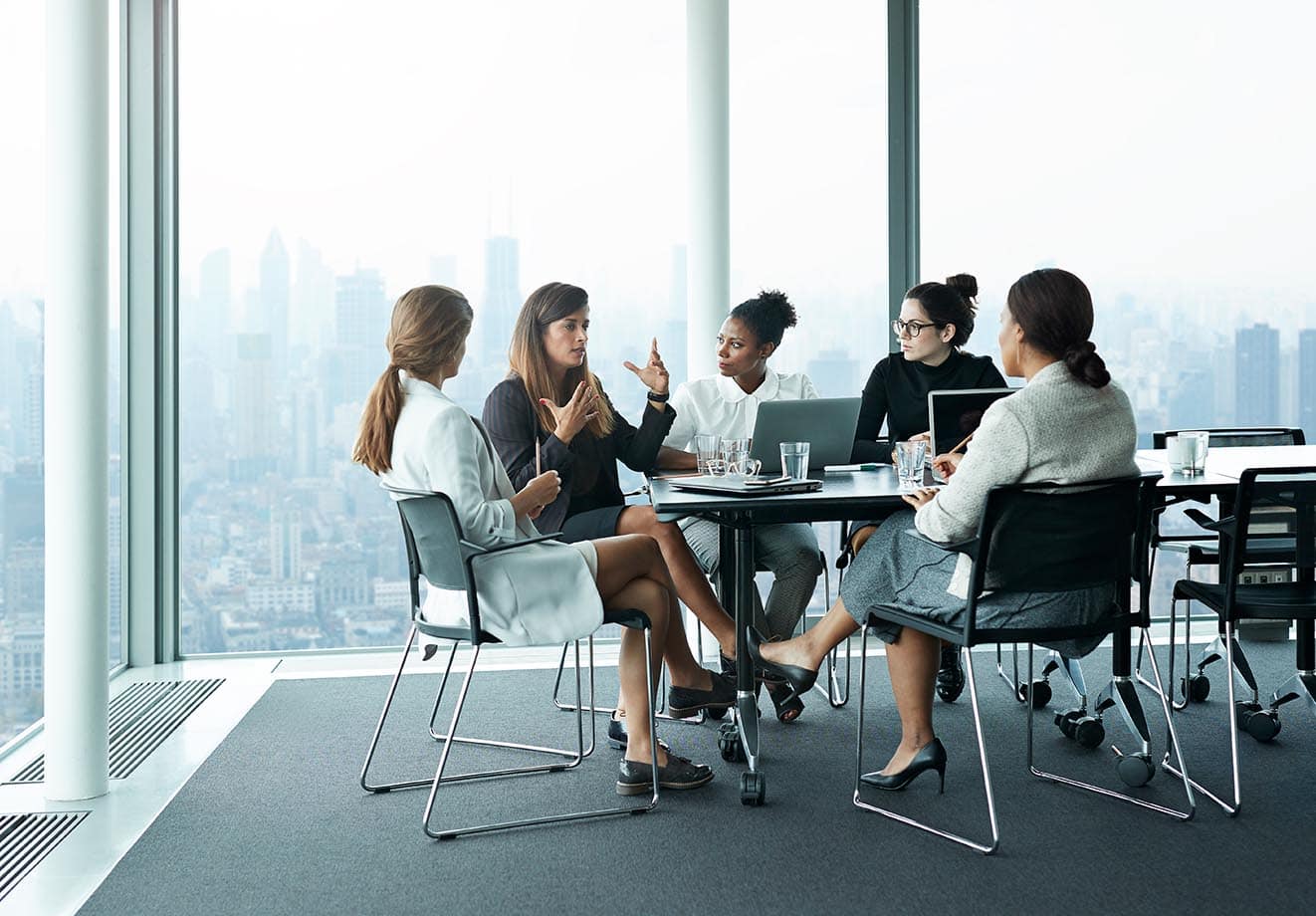 employees gather at a large table for a specialized employee training session