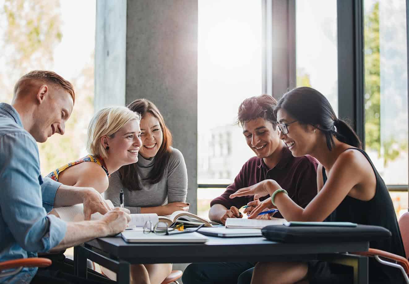 Group of college students working together at a table