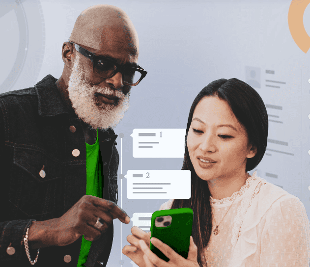 Two workers collaborating on a phone.